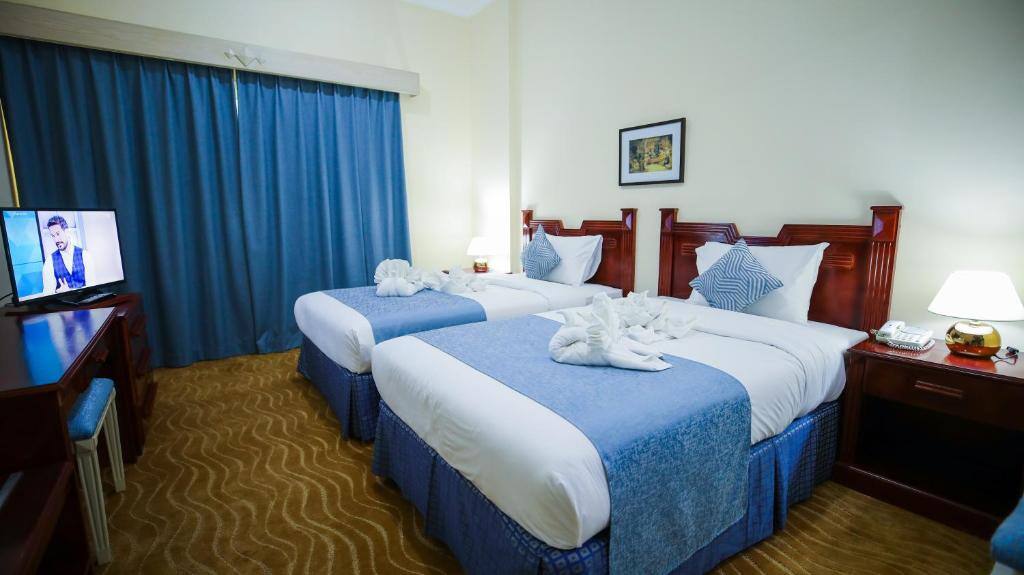 Twin beds in an air-conditioned room at the hotel