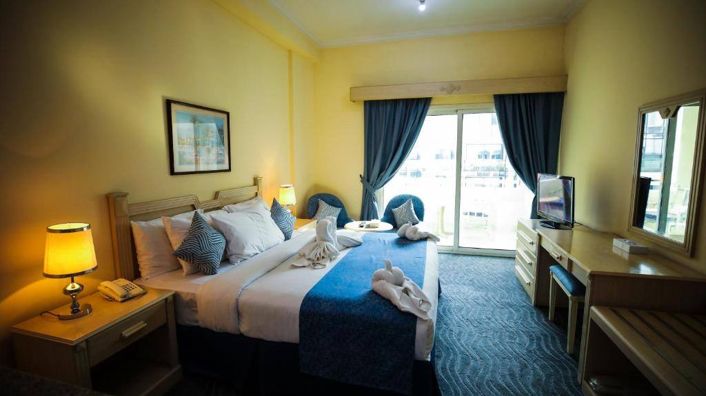 Room with balcony access and city view